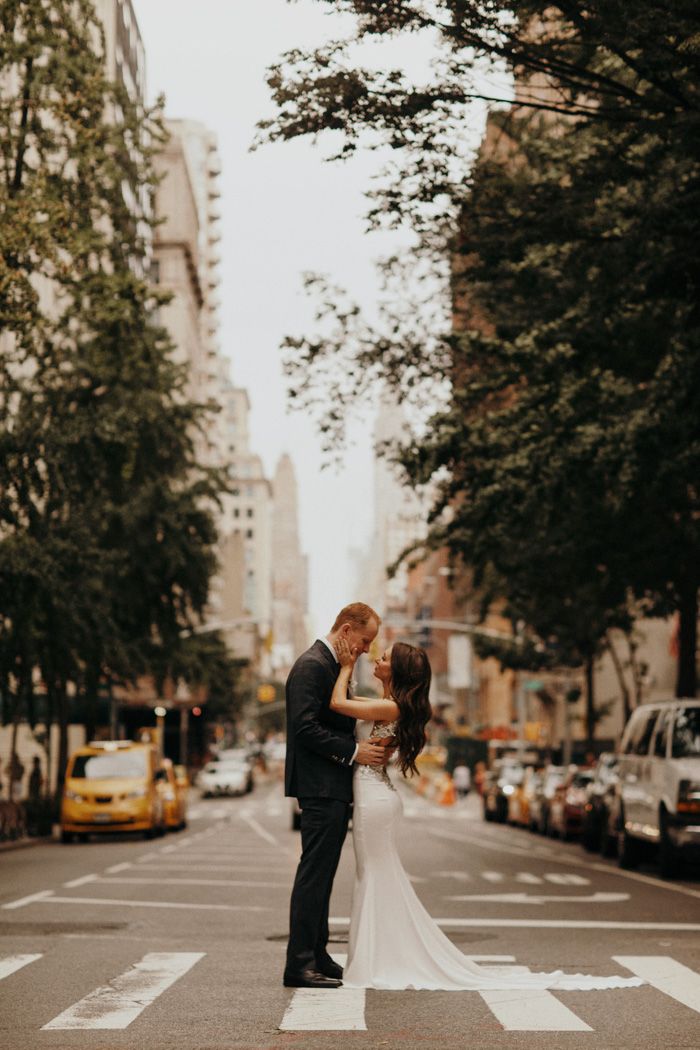 A couple kissing in the middle of a New York crosswalk